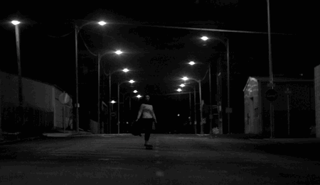 a girl walks home alone at night gif